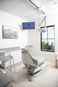 Behind view of treatment room with dental chair
